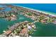 Expansive aerial view of waterfront homes, capturing the stunning coastal scenery and serene canal waterways at 205 Harrison Ave, Belleair Beach, FL 33786