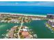 Stunning aerial view of waterfront property with a dock, pool, and Gulf of Mexico access at 205 Harrison Ave, Belleair Beach, FL 33786