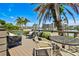 Back deck featuring waterfront views, perfect for enjoying outdoor living and entertaining guests at 205 Harrison Ave, Belleair Beach, FL 33786