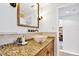 Bathroom featuring a decorative bowl sink and granite countertop at 205 Harrison Ave, Belleair Beach, FL 33786