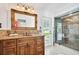 Bathroom with luxurious vanity and a step-in glass shower at 205 Harrison Ave, Belleair Beach, FL 33786