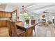 Open-concept dining area boasts granite countertops, chandelier, and outdoor pool views at 205 Harrison Ave, Belleair Beach, FL 33786
