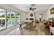 Spacious living room with wood flooring and fireplace, perfect for relaxing and entertaining at 205 Harrison Ave, Belleair Beach, FL 33786