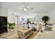 Bright, open living room with hardwood floors, white walls, and stylish, modern furniture at 205 Harrison Ave, Belleair Beach, FL 33786