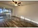 Bright living room with wood floors and sliding glass doors to the outside at 250 Rosery Nw Rd # 220, Largo, FL 33770