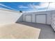 The patio features a spacious layout with a concrete floor and a walled-in perimeter for added privacy at 250 Rosery Nw Rd # 220, Largo, FL 33770