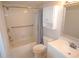 Full bathroom featuring tiled shower and tub combo with updated vanity at 3399 Mermoor Dr # 110, Palm Harbor, FL 34685