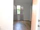 View of bedroom with closet and a window letting in natural light at 3399 Mermoor Dr # 110, Palm Harbor, FL 34685