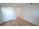Clean bedroom with wood-look floors and a double door closet at 3399 Mermoor Dr # 110, Palm Harbor, FL 34685