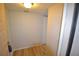 Inviting entryway with wood-look floors, fresh neutral paint and a door to the unit at 3399 Mermoor Dr # 110, Palm Harbor, FL 34685