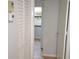 Hallway features wood flooring, a large closet, and a thermostat at 3399 Mermoor Dr # 110, Palm Harbor, FL 34685