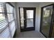 Enclosed sunroom with windows and sliding glass door to the outdoors at 3399 Mermoor Dr # 110, Palm Harbor, FL 34685