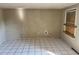 Spacious living area featuring tile flooring and a window allowing natural light to enter at 3406 N 48Th St, Tampa, FL 33605