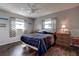 Bedroom with ceiling fan and bedside tables at 3550 100Th N Pl, Pinellas Park, FL 33782