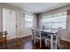 Bright dining room featuring a table and chairs with windows that provide natural light at 3550 100Th N Pl, Pinellas Park, FL 33782