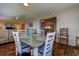 Dining room with seating for four and open to the living room and kitchen at 3550 100Th N Pl, Pinellas Park, FL 33782