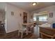 Dining area with table and chairs, seamlessly flowing into the living room at 3550 100Th N Pl, Pinellas Park, FL 33782