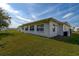 Charming one-story home featuring a well-maintained lawn and a bright exterior at 3550 100Th N Pl, Pinellas Park, FL 33782