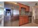 Updated kitchen featuring a stainless steel refrigerator and wood cabinets at 3550 100Th N Pl, Pinellas Park, FL 33782
