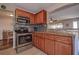 Well-equipped kitchen with stainless steel oven and microwave, plus ample cabinetry at 3550 100Th N Pl, Pinellas Park, FL 33782