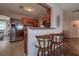 Stylish kitchen with stainless steel appliances, wood cabinets, and a breakfast bar at 3550 100Th N Pl, Pinellas Park, FL 33782