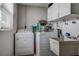 Laundry area with washer, dryer and wash sink at 3550 100Th N Pl, Pinellas Park, FL 33782