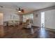 Bright living room with hardwood floors, comfortable seating, and natural light at 3550 100Th N Pl, Pinellas Park, FL 33782