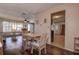 Open living room with hardwood floors, dining table, and plenty of natural light at 3550 100Th N Pl, Pinellas Park, FL 33782