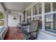 Charming front porch with outdoor seating and tiled flooring at 3550 100Th N Pl, Pinellas Park, FL 33782