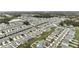 Expansive aerial view of a meticulously planned community with charming homes and verdant landscaping at 36419 Garden Wall Way, Zephyrhills, FL 33541