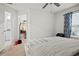 Comfortable bedroom with a walk-in closet and an adjacent bathroom, offering ample storage and convenience at 36419 Garden Wall Way, Zephyrhills, FL 33541