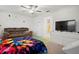 Well-appointed bedroom with a ceiling fan and an en-suite bathroom at 36419 Garden Wall Way, Zephyrhills, FL 33541