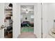 View from a closet of a bedroom featuring bright windows and an en-suite bathroom at 36419 Garden Wall Way, Zephyrhills, FL 33541