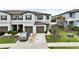 Well maintained townhome with a one-car garage and driveway parking at 36419 Garden Wall Way, Zephyrhills, FL 33541