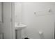 Clean half-bathroom with a white pedestal sink at 36419 Garden Wall Way, Zephyrhills, FL 33541