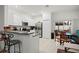 Bright kitchen with stainless steel appliances, granite countertops, and a breakfast bar at 36419 Garden Wall Way, Zephyrhills, FL 33541