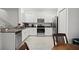 Bright kitchen with stainless steel appliances and modern white cabinetry at 36419 Garden Wall Way, Zephyrhills, FL 33541