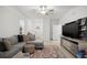 Bright living room featuring neutral colors and tile floors at 36419 Garden Wall Way, Zephyrhills, FL 33541