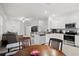 Open floorplan with cozy living area and modern kitchen for seamless entertaining at 36419 Garden Wall Way, Zephyrhills, FL 33541