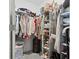 Spacious walk-in closet with custom shelving provides ample storage for clothes, shoes, and accessories at 36419 Garden Wall Way, Zephyrhills, FL 33541