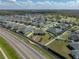 An aerial view highlights the home's position in a Gathering-friendly neighborhood near green spaces and a golf course at 4043 Salida Del Sol Dr, Sun City Center, FL 33573