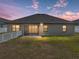 The backyard features partial fence, small patio and lush green lawn at 4043 Salida Del Sol Dr, Sun City Center, FL 33573