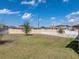 Picture of spacious backyard featuring a manicured lawn and white vinyl fence at 4043 Salida Del Sol Dr, Sun City Center, FL 33573