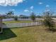 This spacious backyard features a meticulously maintained lawn and a white vinyl fence at 4043 Salida Del Sol Dr, Sun City Center, FL 33573