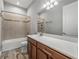 Bathroom featuring a shower-tub combo, and vanity with a white countertop and dark wood cabinets at 4043 Salida Del Sol Dr, Sun City Center, FL 33573