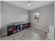 Bedroom with natural light and storage unit with wood-look floors at 4043 Salida Del Sol Dr, Sun City Center, FL 33573