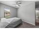 Bedroom featuring carpet and view of the ensuite bathroom at 4043 Salida Del Sol Dr, Sun City Center, FL 33573