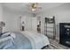 Bedroom featuring a safe, TV, and ensuite bathroom and living room at 4043 Salida Del Sol Dr, Sun City Center, FL 33573