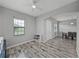 Bonus room with a ceiling fan, natural light and wood-look floors at 4043 Salida Del Sol Dr, Sun City Center, FL 33573