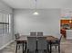 View of the dining room featuring modern table and chairs with view to kitchen at 4043 Salida Del Sol Dr, Sun City Center, FL 33573